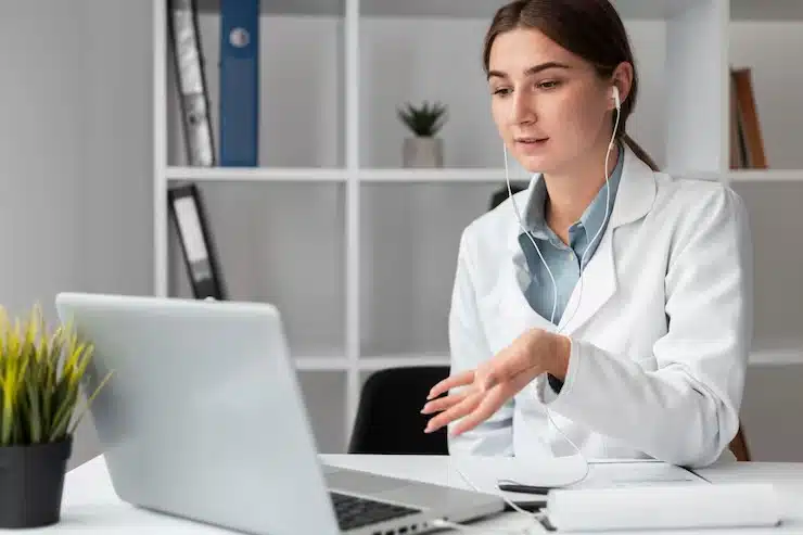 Virtual Dental Receptionist talking to her client on laptop