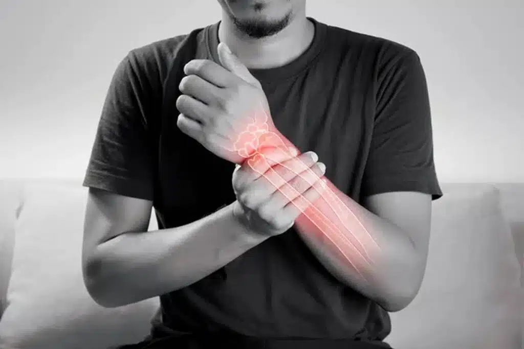 man experiencing chronic pain in his wrist management in wellington florida